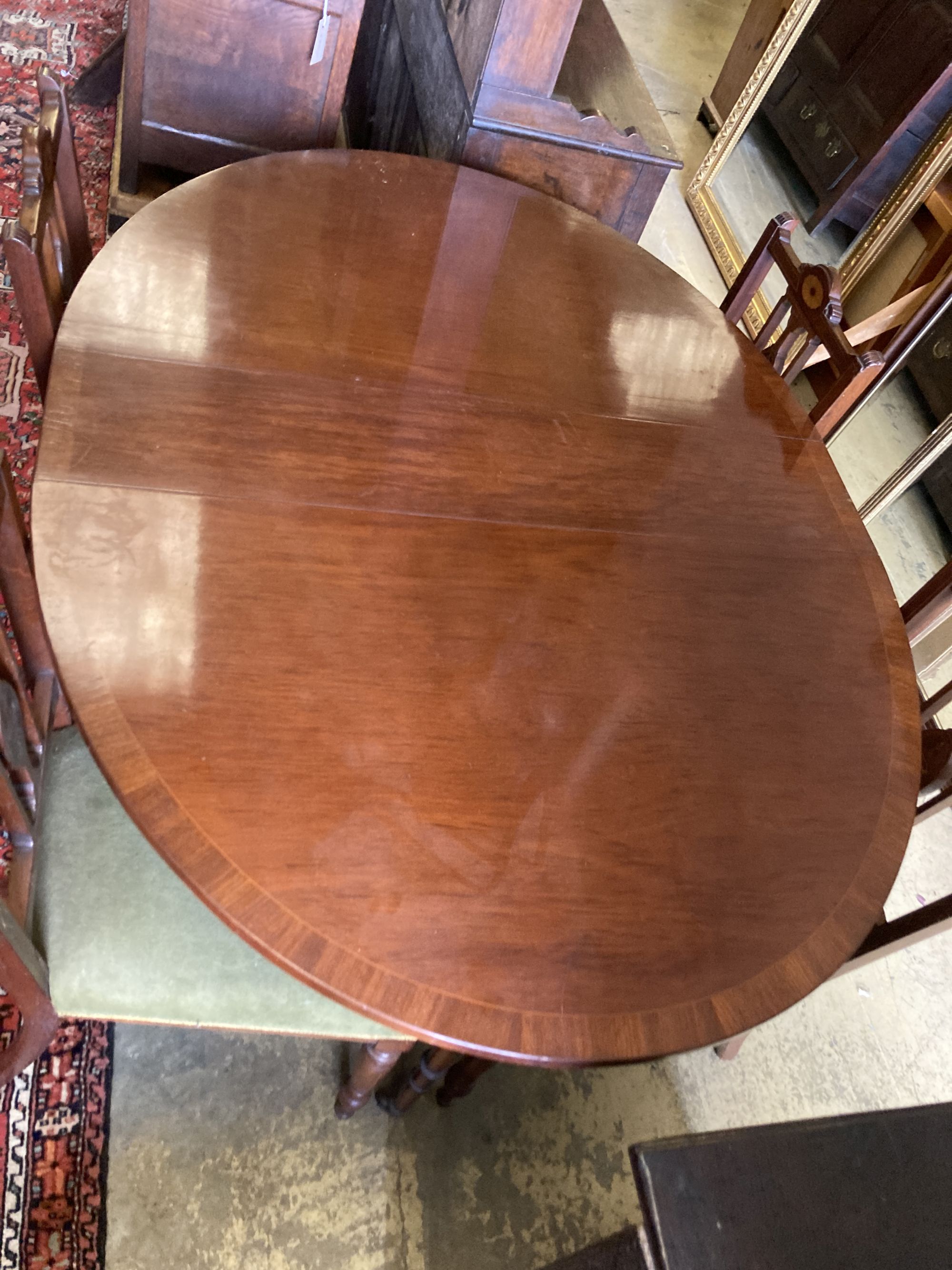 A Victorian style banded mahogany drop flap dining table, 138cm extended together with a set of four Edwardian inlaid mahogany dining c